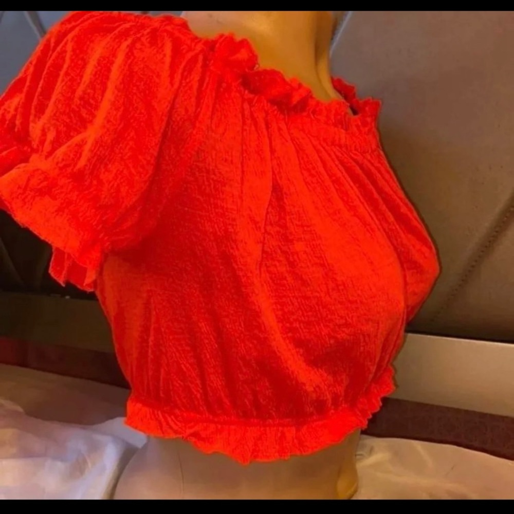 A bright red off the shoulders crop top.